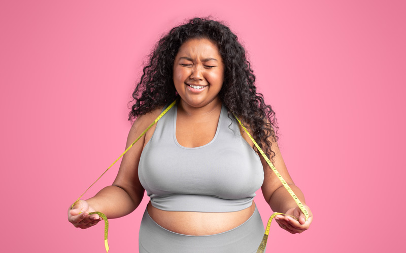 unhappy sad plus size woman in sportswear